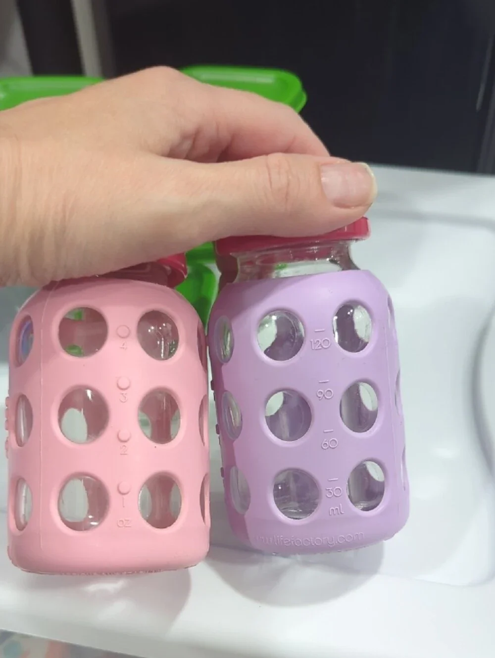 Glass Food Storage Set with Green Lids and Assorted Silicone Bottles